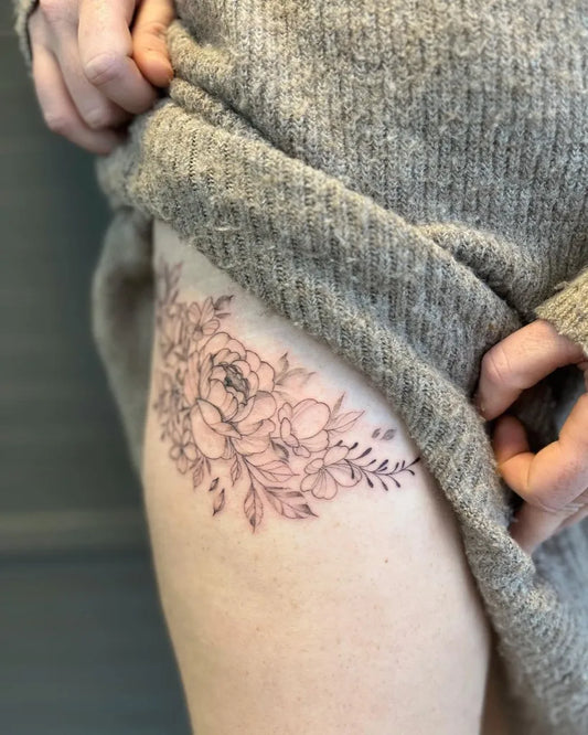 Medium FineLine Peony and Leaves Tattoo on Women Hip by @amberbreeze.tattoo