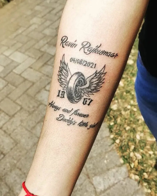 Medium FineLine RavenNameWingedTire on Women Arm Tattoo by @shaheen.maharaj