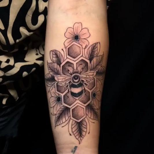 Medium Floral Bee honeycomb flowers on Women Arm Tattoo by @tirtainktwo_balitattoo