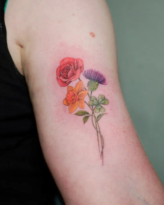 Medium Floral Botanical Daffodil Rose Thistle Tattoo on Women Arm by @miamelleo_tattoo