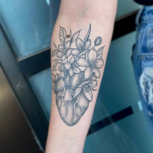 Medium Floral Heart and Flowers on Women Arm Tattoo by @darekriley