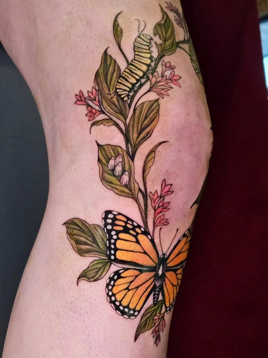 Medium Floral Monarch Butterfly Caterpillar Nature Tattoo on Women Thigh by @botanicalteepee