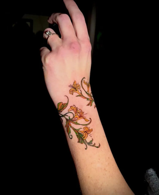 Medium Floral Wristband Lily Vines Nature Tattoo on Women Wrist by @forest_fairy_tattoos