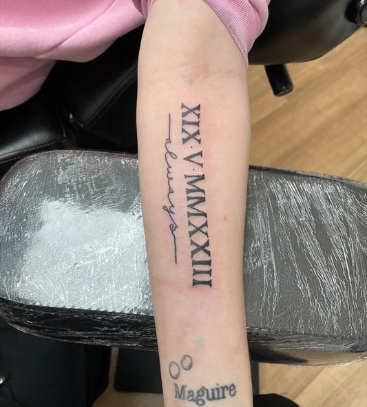 Medium Forearm Script Roman Numerals and Name on Women Arm Tattoo by @tattoophils