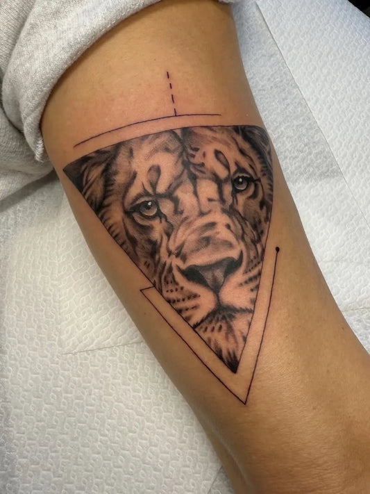 Medium Geometric Black and Grey Lion on Men Arm Tattoo by @jimmyarkenbout