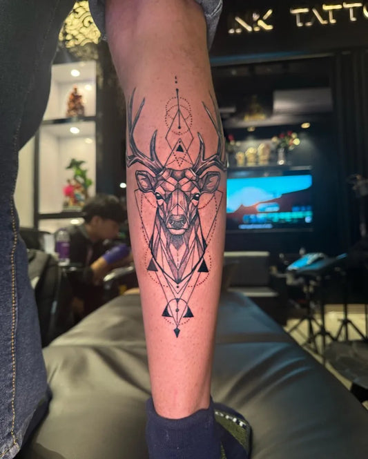 Medium Geometric Deer Tattoo on Men Leg by @patna_ink