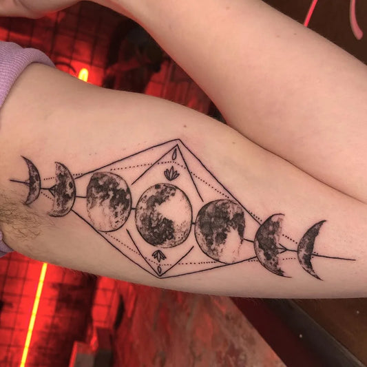 Medium Geometric Moon Phases Tattoo on Women Arm by @sarahlouisetattoos