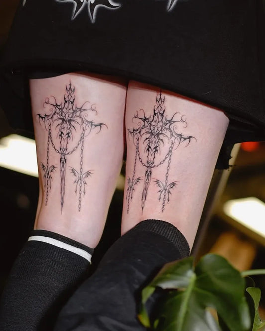 Medium Gothic Cross with Chains Tattoo on Women Thighs by @gothic.angel.tattoo
