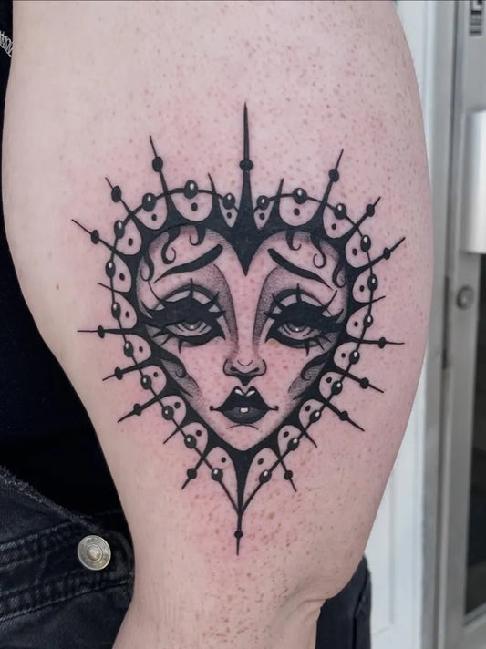 Medium Gothic Heart Face on Women Arm Tattoo by @meganlee.tattoo