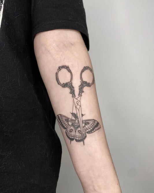 Medium Gothic Scissors Moth Tattoo on Women Arm by @i.want.it.black.tattoo