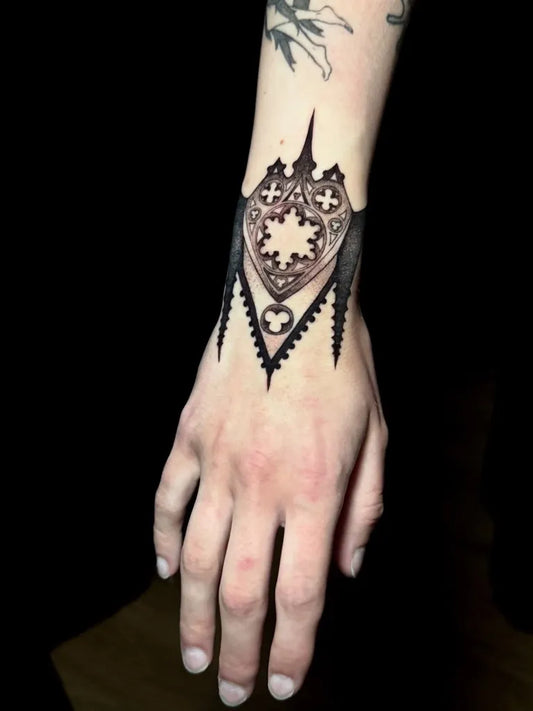 Medium Gothic Shield Tattoo on Men Wrist by @vermillion.tattoos