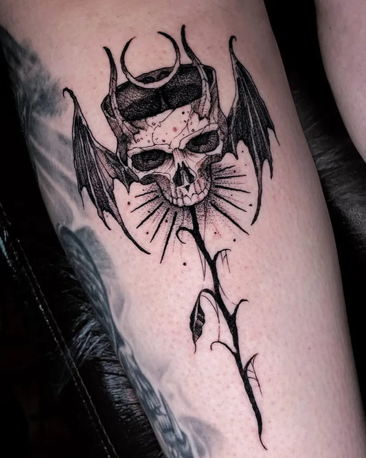 Medium Gothic Skull Wings Stem on Women Thigh Tattoo by @alesoares.tattoo
