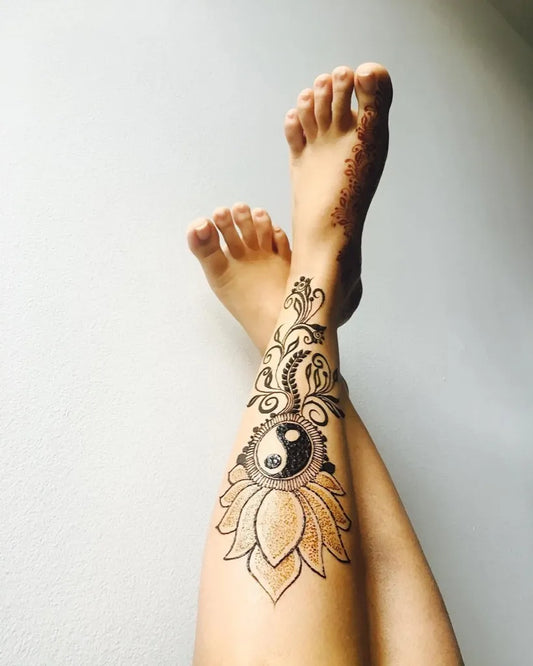 Medium Henna Yin Yang Lotus Tattoo on Women Leg by @hennabymansi
