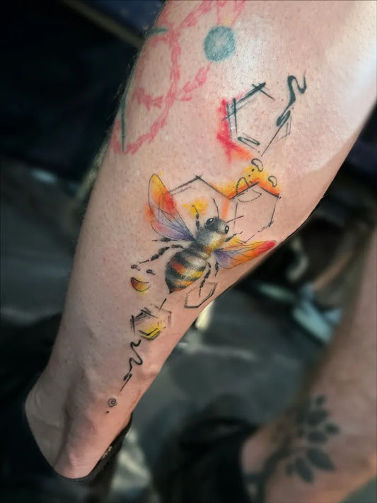 Medium Illustrative Bee with honeycomb and giraffe on Men Arm Tattoo by @sabi.ink