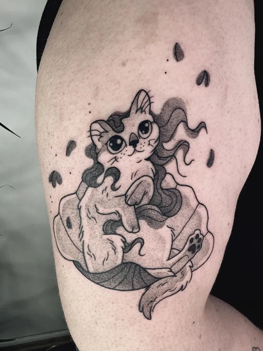 Medium Illustrative Cat with Flowers Tattoo on Women Arm by @agnesbertothy