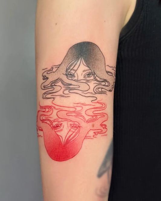 Medium Illustrative Face and Octopus Tattoo on Women Bicep by @irezumijun