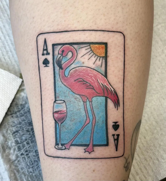 Medium Illustrative Flamingo Ace of Spades Card Tattoo on Women Leg by @skinprints