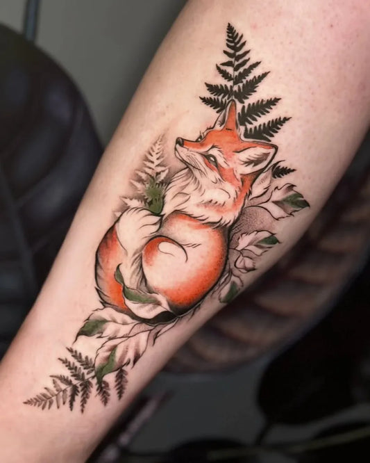 Medium Illustrative Fox and Ferns Tattoo on Women Arm by @bluejay_tattoo