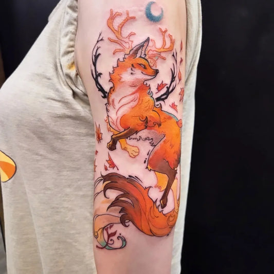 Medium Illustrative Fox with Antlers and Autumn Leaves Tattoo on Women Arm by @harpy.inks