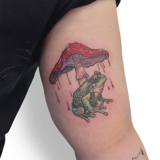 Medium Illustrative Frog and Mushroom Tattoo on Women Arm by @antartika_tattoo