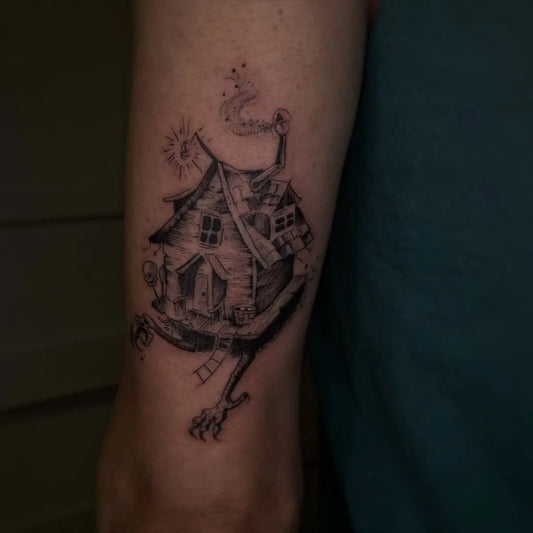 Medium Illustrative Haunted House with Spider Legs Tattoo on Men Arm by @fishbu.ink