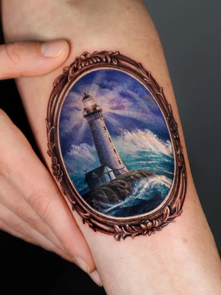 Medium Illustrative Lighthouse in Frame Tattoo on Women Arm by @marily_tattoo