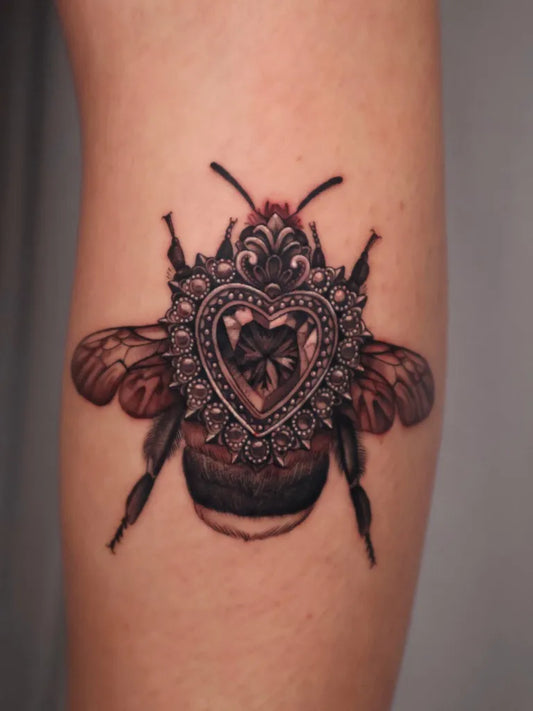 Medium Illustrative Ornate Bee with Heart on Women Thigh Tattoo by @hellabellatattoos