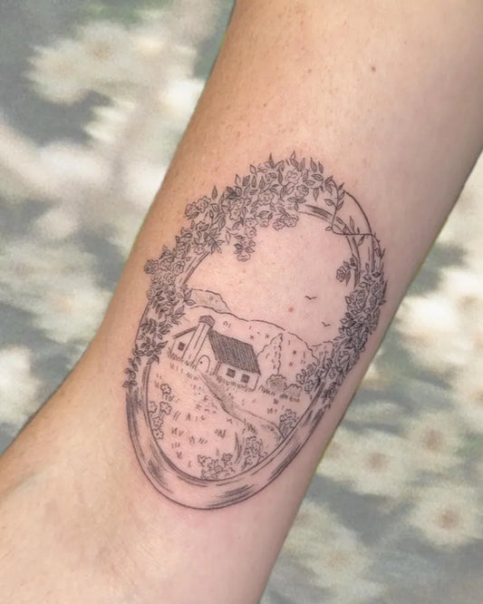 Medium Illustrative Oval Framed Farmhouse and Flowers Tattoo on Women Arm by @mousetats