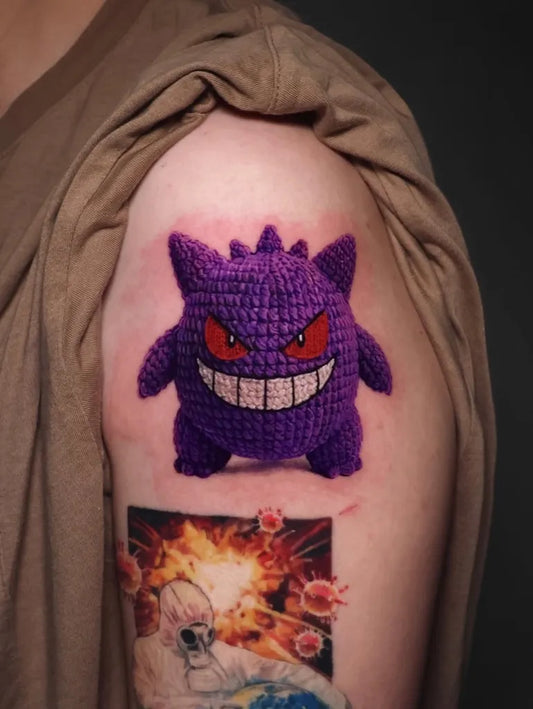 Medium Illustrative Pokemon Haunter with Explosion and Skull Tattoo on Men Shoulder by @theartoftattooingofficial