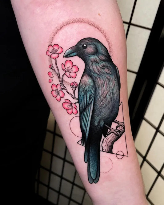 Medium Illustrative Raven with Cherry Blossoms on Women Arm Tattoo by @caravanessa.tattoo