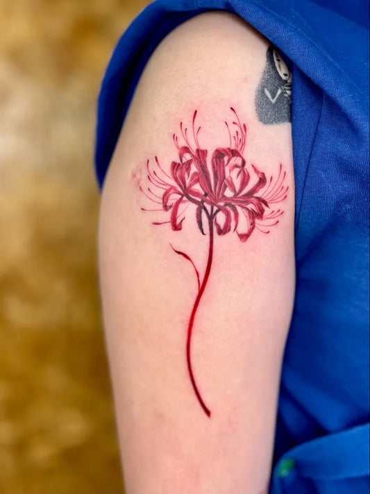 Medium Illustrative Red Spider Lily Tattoo on Women Shoulder by @jp.pintadon