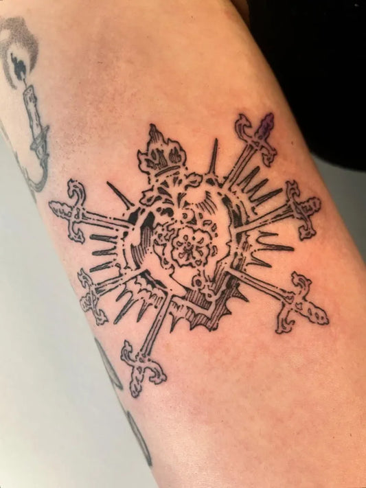 Medium Illustrative Sacred Heart with Crown and Swords Tattoo on Women Arm by @clown.collegiate