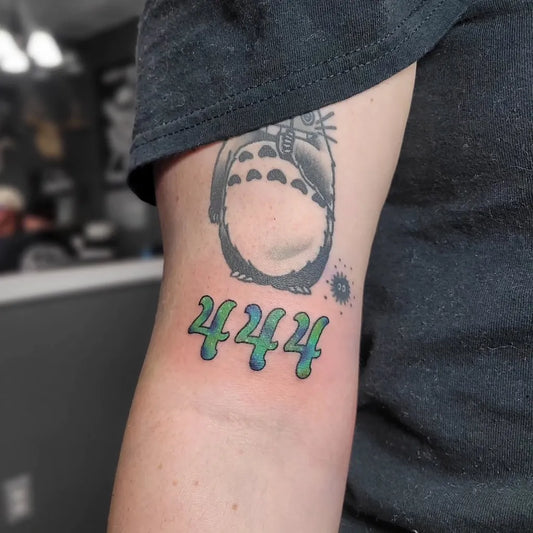 Medium Illustrative Totoro with 444 on Women Arm Tattoo by @little_firebreather