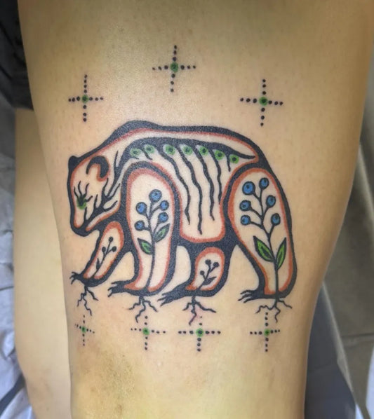 Medium Inuit Bear and Flowers on Women Leg Tattoo by @inkedbeader13