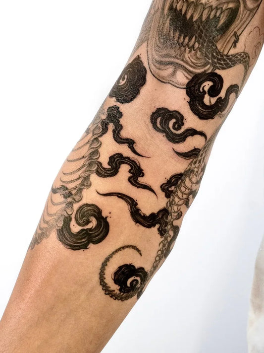 Medium Irezumi Cloud Dragon Tattoo on Men Arm by @oaastudio