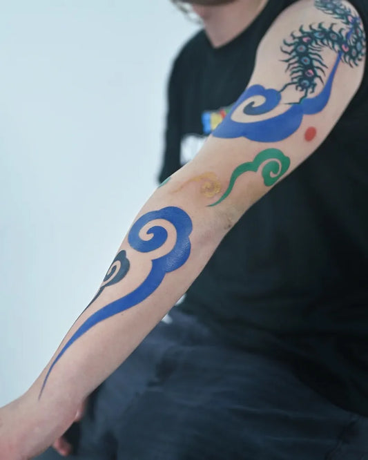 Medium Irezumi Clouds and Waves Tattoo on Men Arm by @hansiitattoo