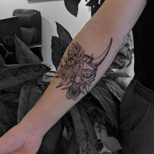 Medium Irezumi Oni Mask with Flowers on Women Arm Tattoo by @tinymenace.ali