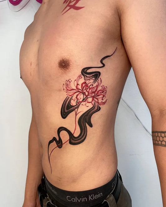 Medium Irezumi Red Spider Lily with Swirling Lines Tattoo on Men Side by @nizi_tattoo
