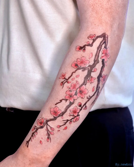 Medium Japanese Cherry Blossom Branches on Men Arm Tattoo by @y.newbro