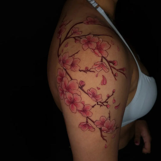 Medium Japanese Cherry Blossom Branches on Women Shoulder Tattoo by @vickii.tatts