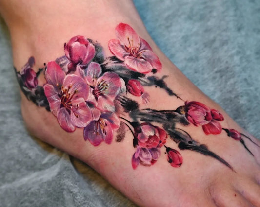 Medium Japanese Cherry Blossom on Women Foot Tattoo by @sentimental_laundry
