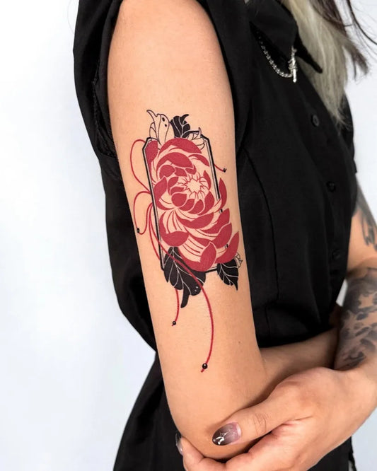 Medium Japanese Chrysanthemum Red with Leaves and Strings Tattoo on Women Arm by @offtattooer