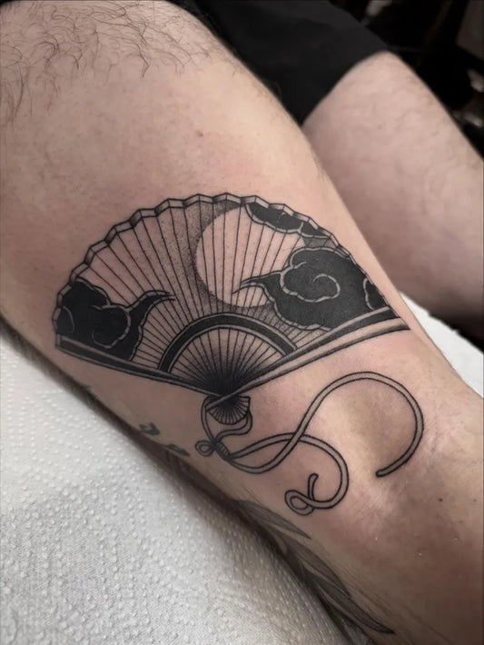 Medium Japanese Fan and Cloud Tattoo on Men Thigh by @robinwilliamstattooer