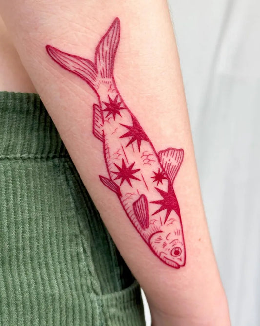 Medium Japanese Fish with Stars Tattoo on Women Arm by @pelc.tt