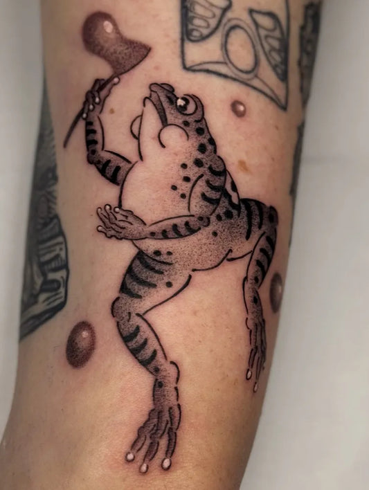 Medium Japanese Frog with Hammer Tattoo on Men Arm by @tommasotattonitattoo