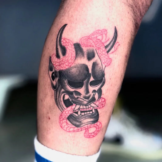 Medium Japanese Oni Mask with Snakes on Men Leg Tattoo by @orhanyilmaztattoo
