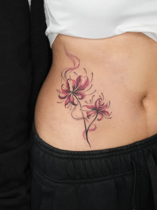 Medium Japanese Spider Lily Red Tattoo on Women Hip by @soul_imagez_tattoo