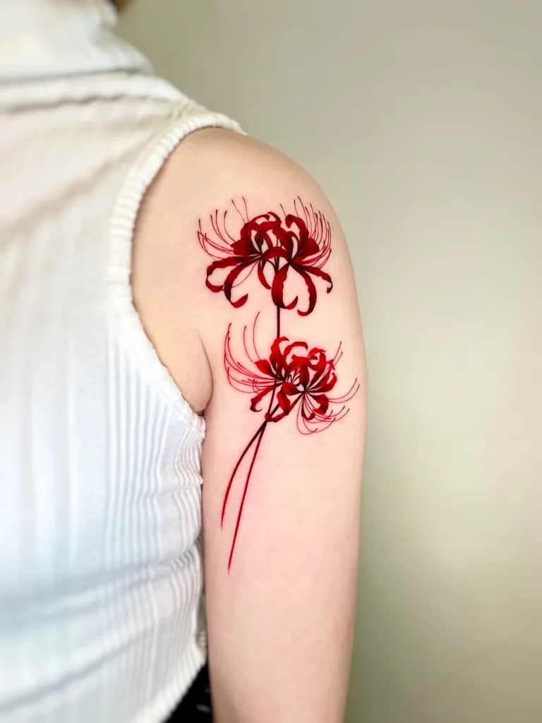 Medium Japanese Spider Lily Red Tattoo on Women Shoulder by @boratattoo
