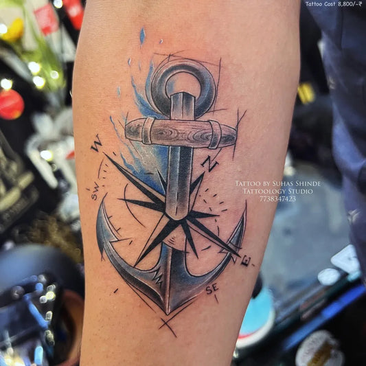 Medium Linework Anchor and Compass Tattoo on Men Arm by @tattoology_studio