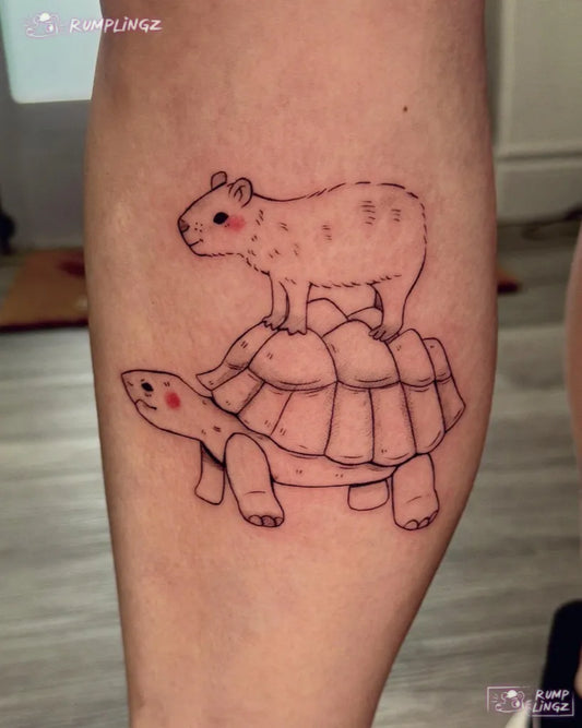 Medium Linework Capybara on Turtle Tattoo on Women Leg by @rumplingz